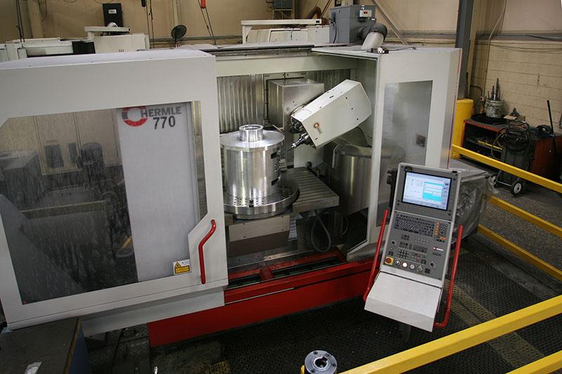 Five axis machining of a 6061 aluminum semiconductor industry component.